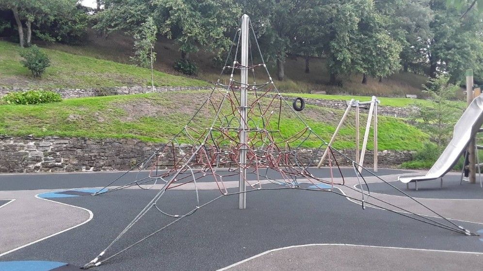 Image of a climbing rope frame in a playground