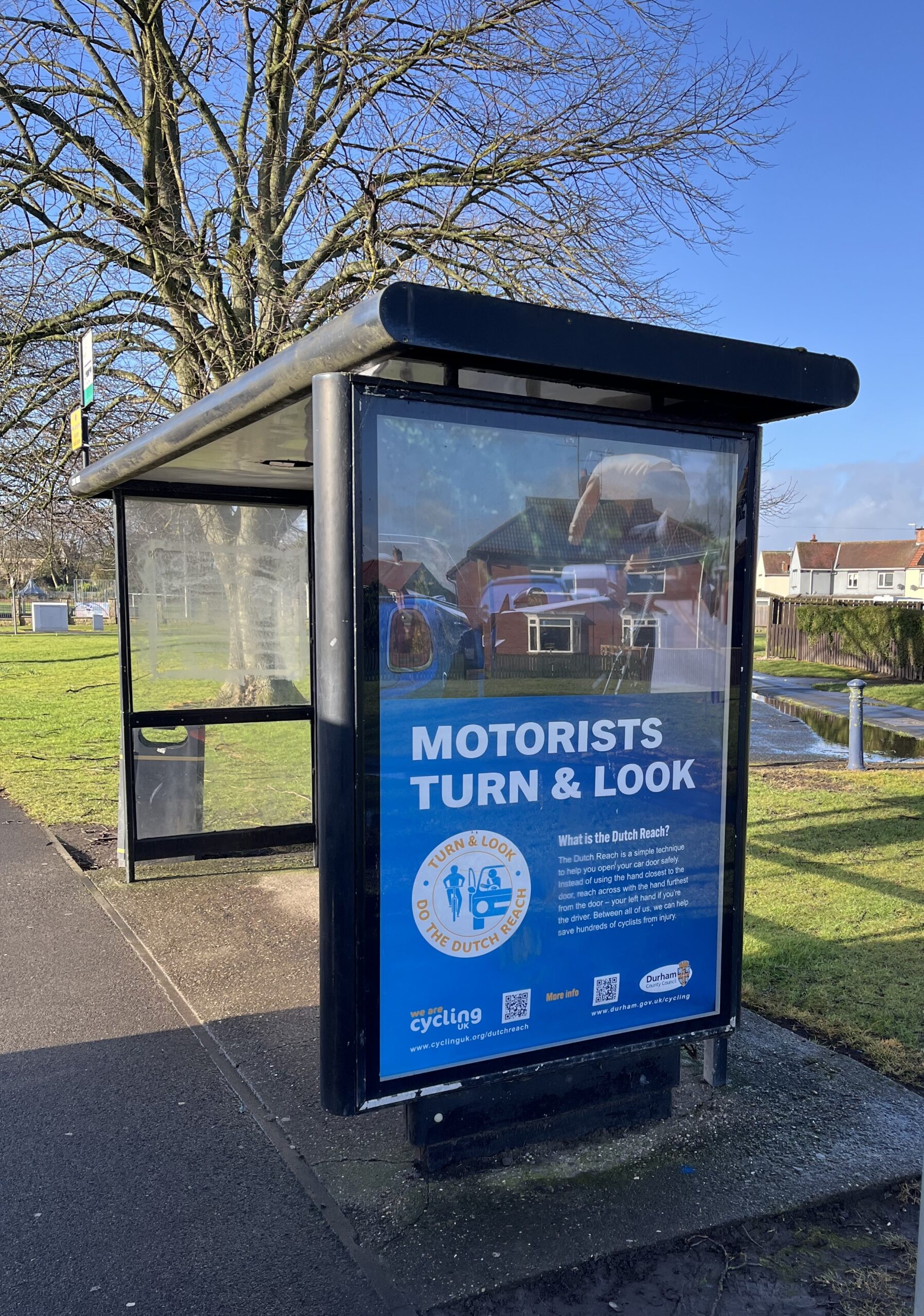 Picture of a motorists turn and look advert in an adshel