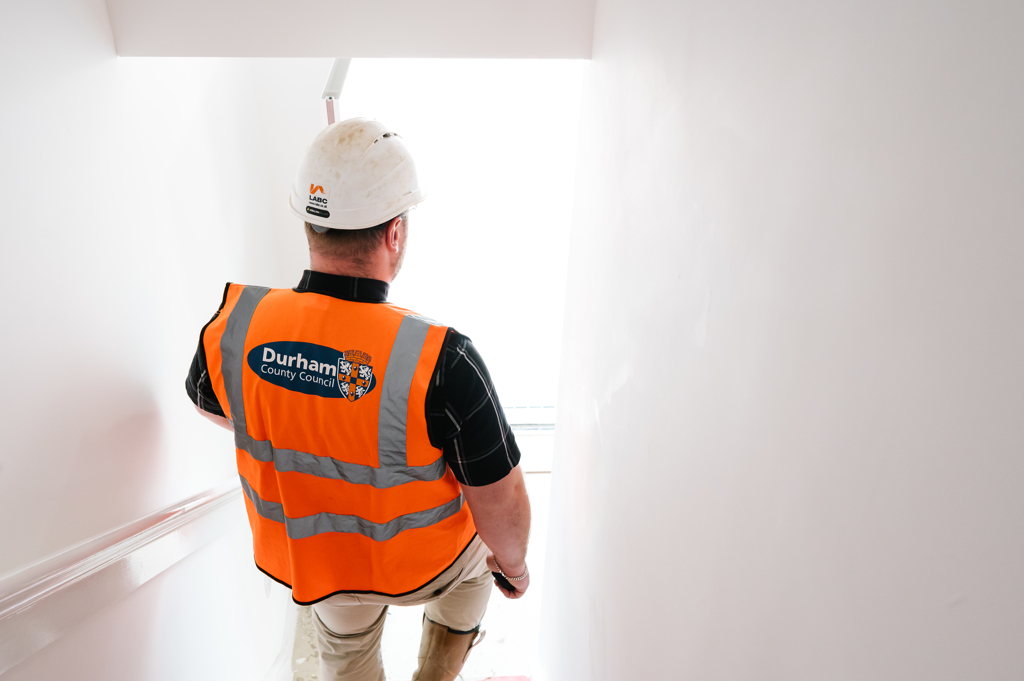 A Builder walking down some stairs