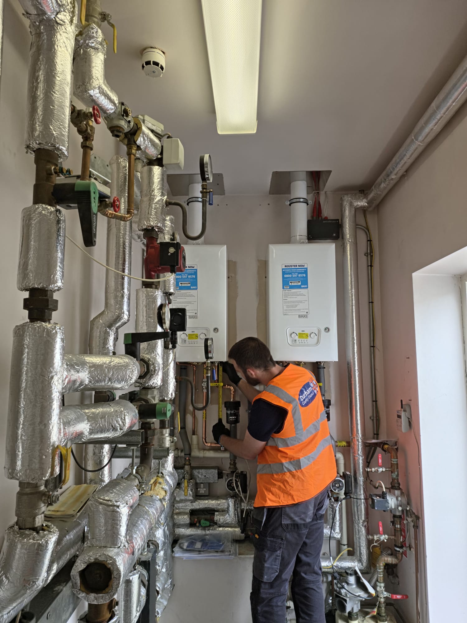 Engineer fixing boiler