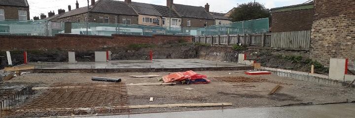 Citizen House site cleared and slab ready for construction