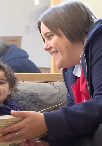 Carer reading to children