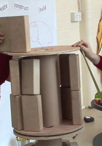 Girl and boy playing with blocks