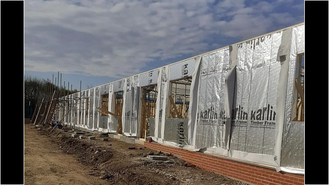 Installation of insulation to timber frame.