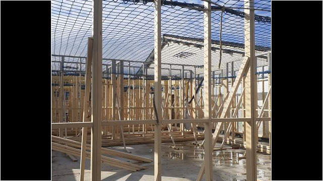 Erection of timber frame.