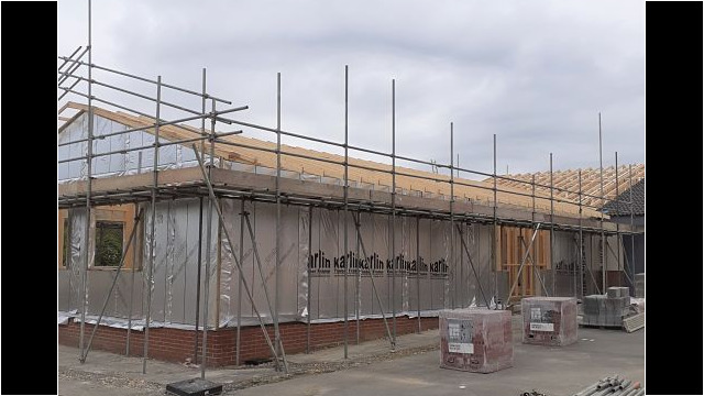 Scaffolding has been erected up to roof level.
