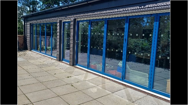external image of new building extension project featuring full glass windows