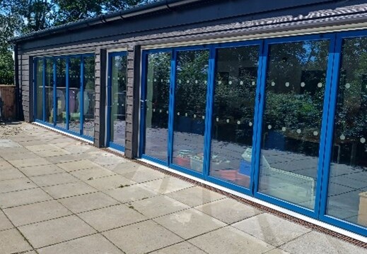 external image of new building extension project featuring full glass windows