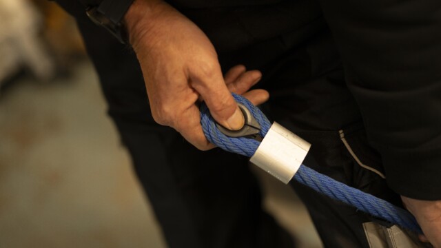 Blue playground rope in hand