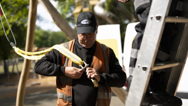 A gentleman building playground equipment