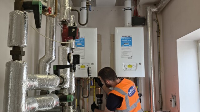 Engineer fixing boiler
